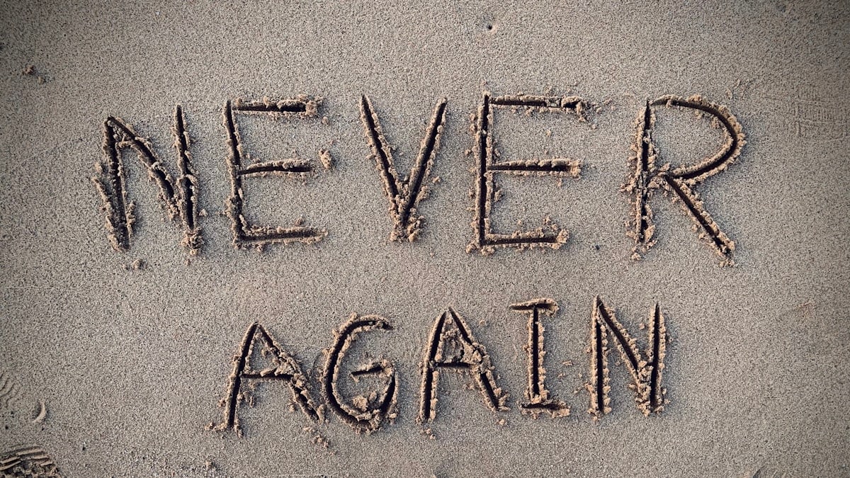 never again sand writing